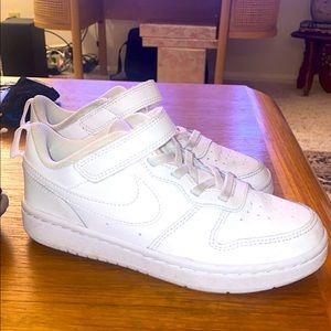 White Boy's Nike shoes.